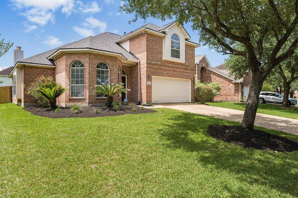 With its classic brick exterior, arched windows, and neatly landscaped front yard, this home offers standout curb appeal that welcomes you in from the moment you arrive.