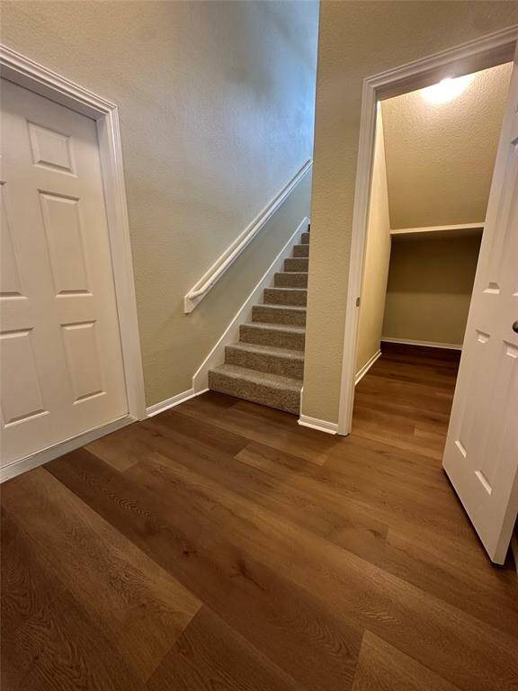 Photos are of a town home with the same floor plan. The town home for lease is a flipped version of this floor plan with a tile entry, vinyl floors in kitchen and bathrooms, carpet throughout, white range, white dishwasher, and the same stainless fridge as you see in these photos.