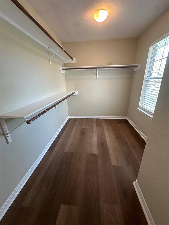 Photos are of a town home with the same floor plan. The town home for lease is a flipped version of this floor plan with a tile entry, vinyl floors in kitchen and bathrooms, carpet throughout, white range, white dishwasher, and the same stainless fridge as you see in these photos.