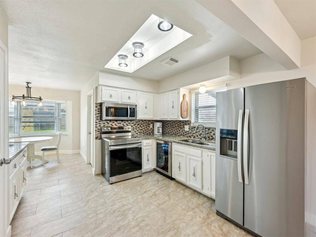 The stainless appliances give a sleek look to the Kitchen, as does the updated lighting!