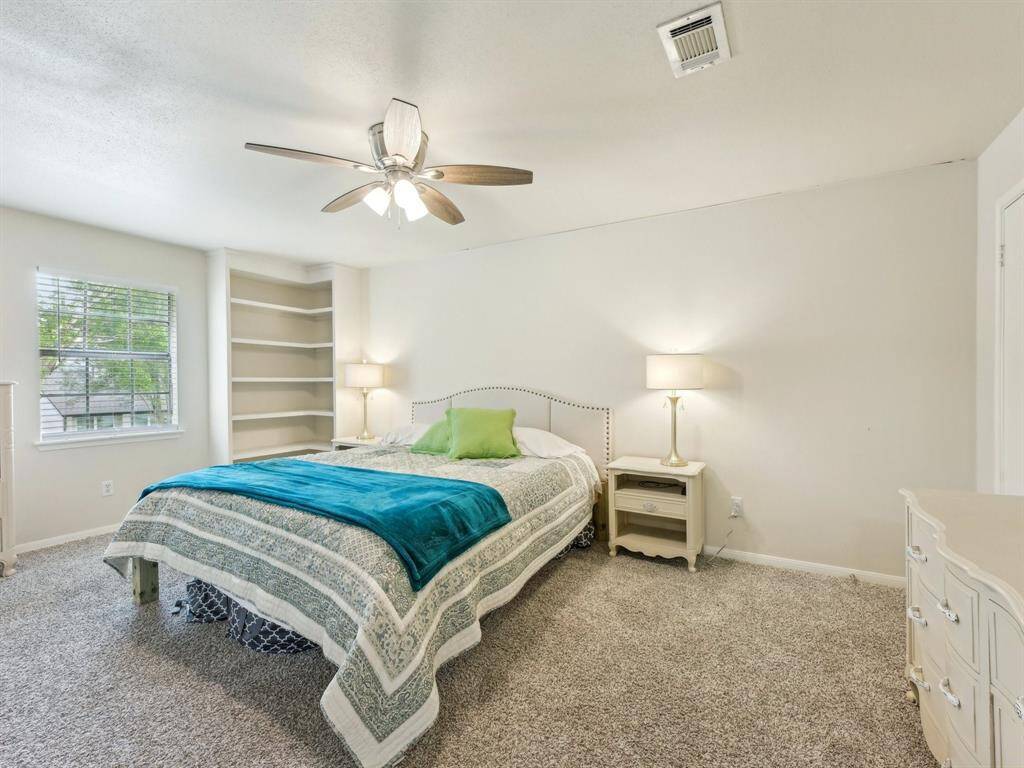 The Primary Bedroom is so spacious! Take a look at the built-ins in the corner - the perfect place to store your books for some bedtime reading!