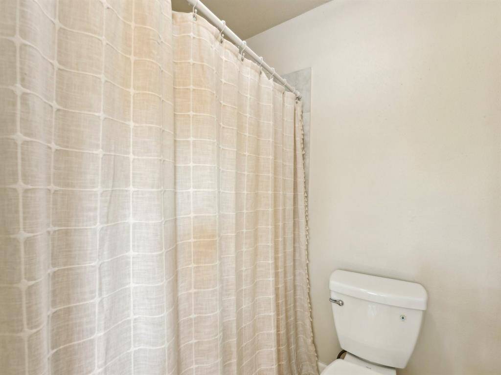 The tiled shower in the Primary Bathroom is a great place to wash your cares away.