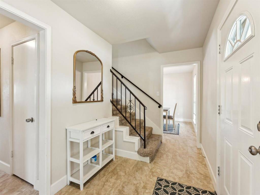 Gorgeous tile flooring extends throughout the first floor