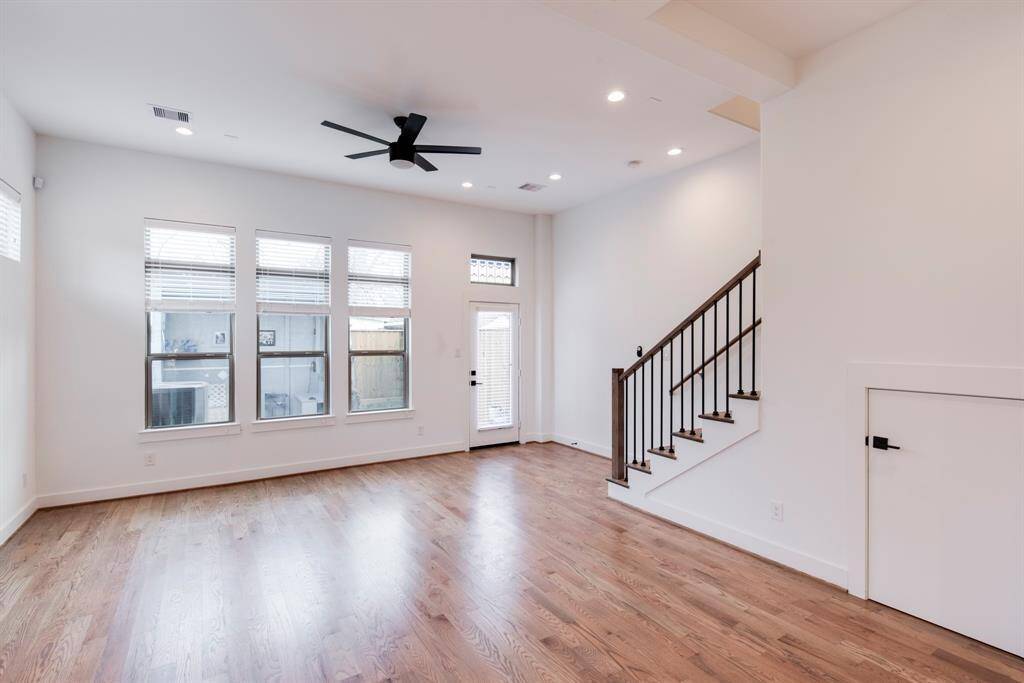 Living area with window into the backyard.