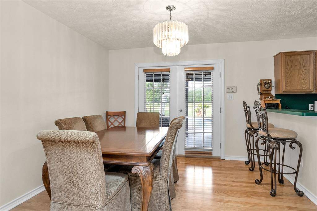 Breakfast area with double doors that open to the back patio
