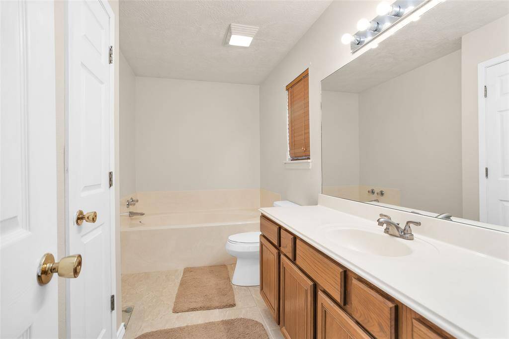 Primary bathroom with separate tub and shower