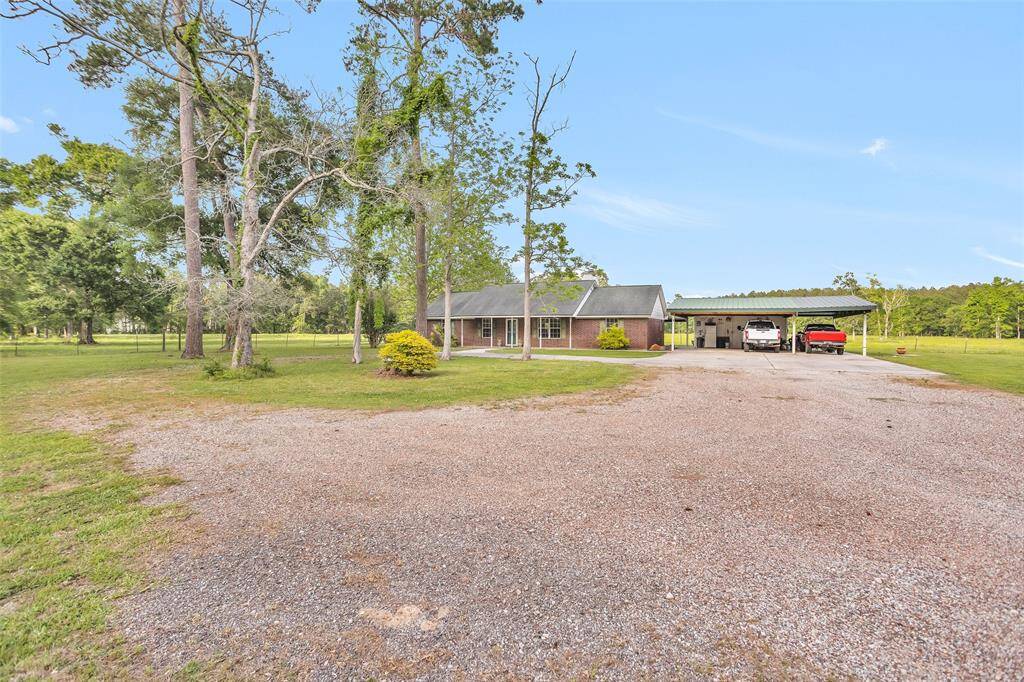 Front of home from driveway offering plenty of places to park