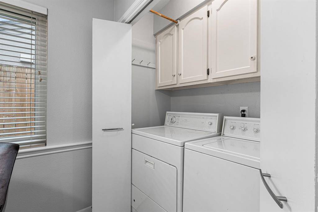 Washer and Dryer offset from breakfast area, included with the home!