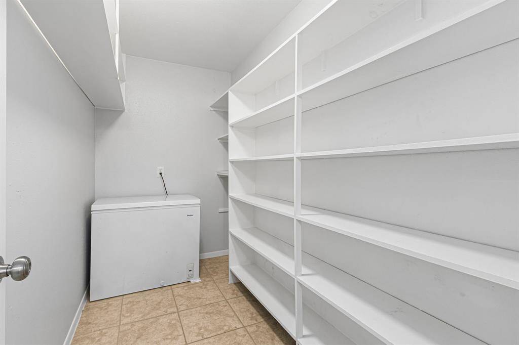 An organizer's dream for a Pantry! Deep freezer shown here, included with the home!