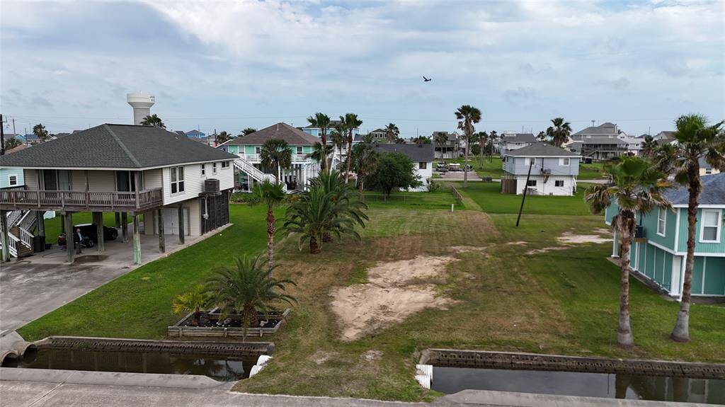 Beautiful lot with palm trees and private boat slip