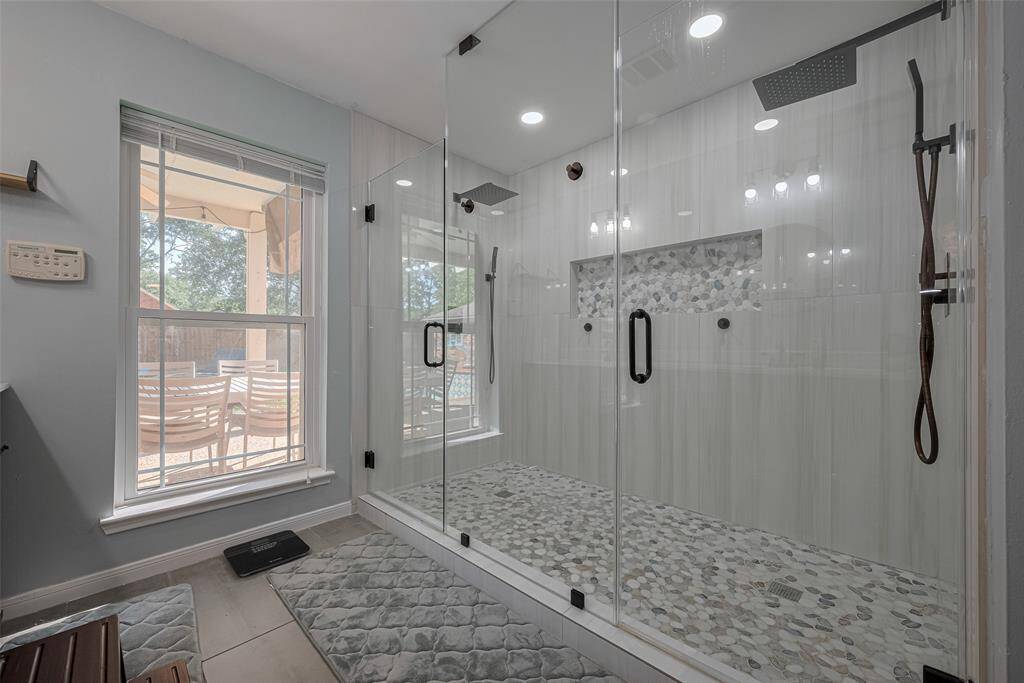 Primary bath has a massive walk in shower