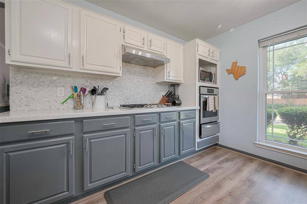 New wall oven quartz countertops and updated flooring