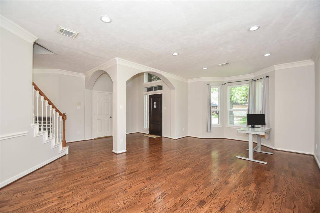 What a fabulous view of your main entrance/foyer, from the inside of this versatile front space. As suggested, it may become a home office . . . or whatever fits your lifestyle!