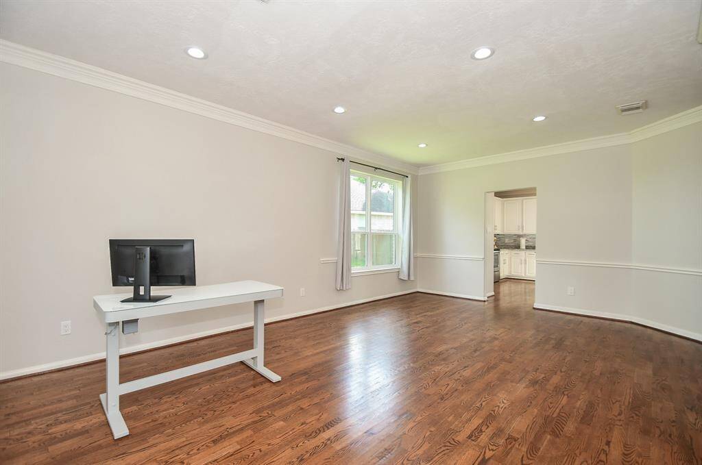 The huge space right off the kitchen would be a probable spot for formal dining. There's plenty of room here for sizeable pieces and serving accents.