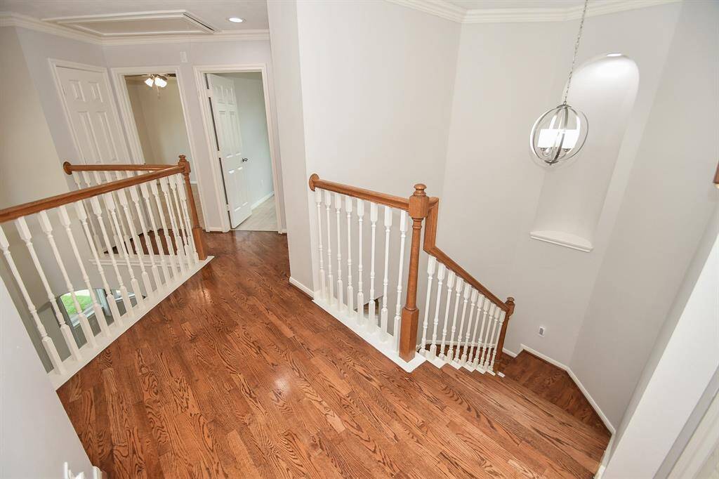 What a lovely view of glistening floors leading to 2nd story bedrooms.