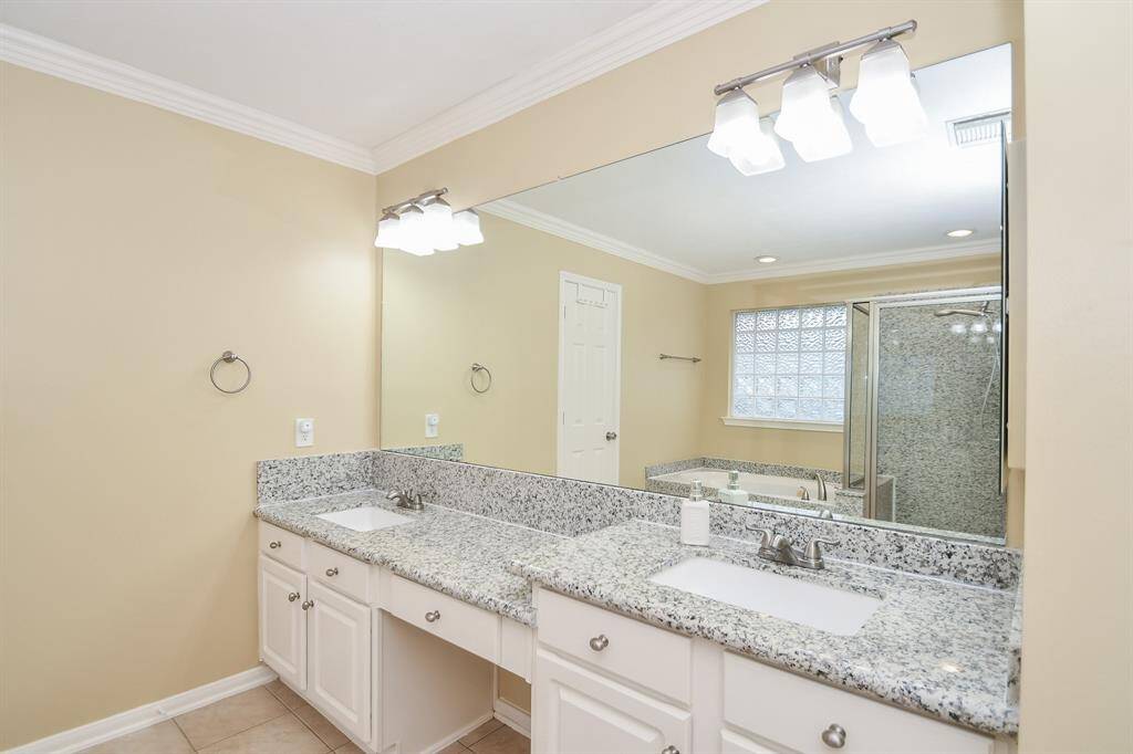 Minimal, yet stunning amenities, provide absolute peace and relaxation in your glowing primary, ensuite bath. Luscious granite countertops house dual-leveled, dual sinks/vanity below with good storage.