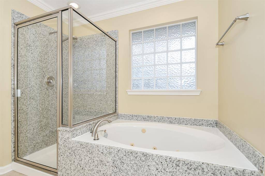 This charming art-deco-like window above the jetted Hollywood tub is so alluring. Take your pick: a long, languishing soak or a quick refreshing shower after a long move-in day!