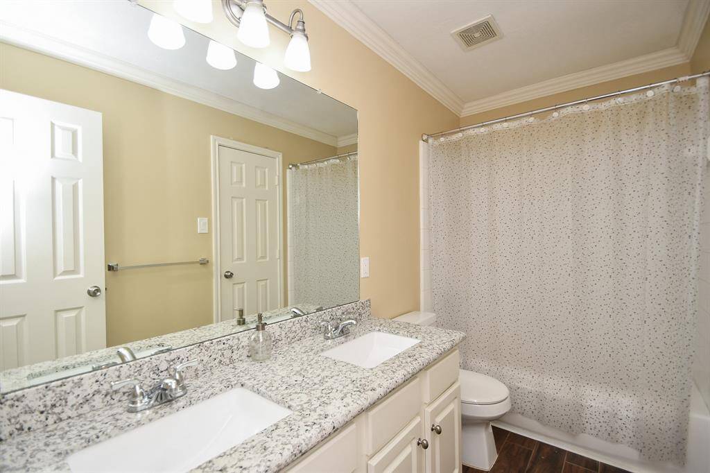 This dual-sink secondary bath offers all the comforts of its primary counterpart; with a combined shower/bath tub for easy options.