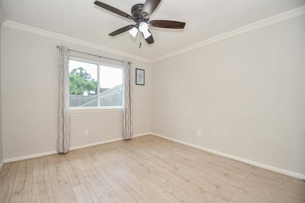 Great open wall and floor space is yours to configure in a secondary bedroom.