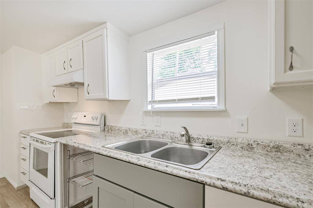 Kitchen with window to back area
