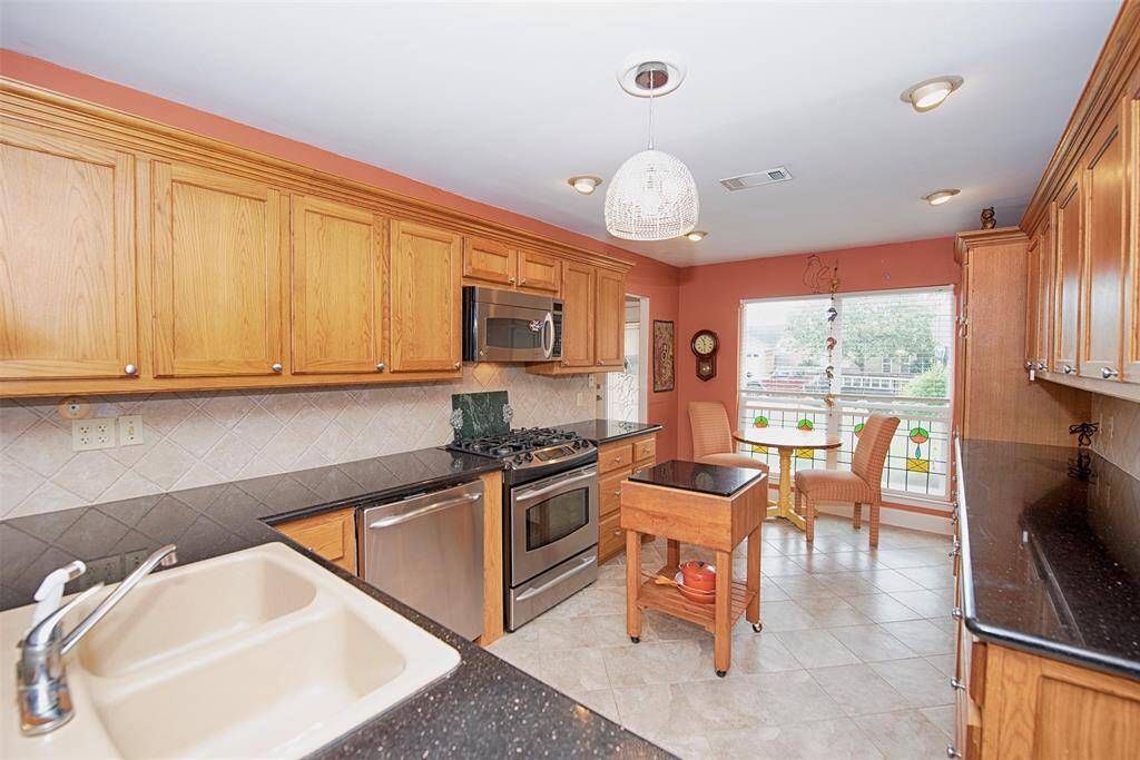 Kitchen provides amazing space, granite counters and incredible storage.