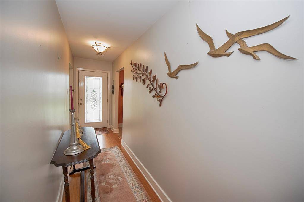 Lovely foyer with updated bamboo limited floors. Even room for a catch all table.