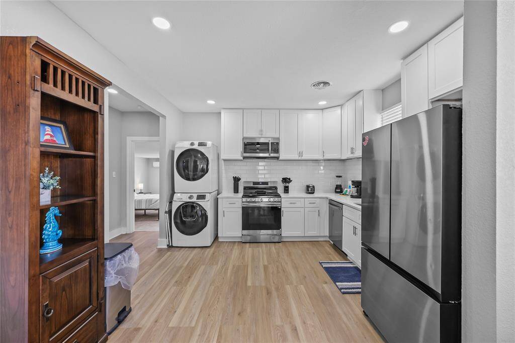As you enter you are greeted with an open concept featuring newly installed floors, updated kitchen, and recessed lighting!