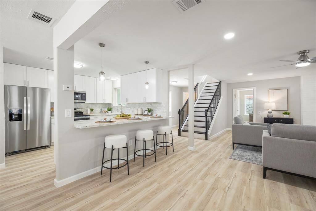 Kitchen opens to living room...