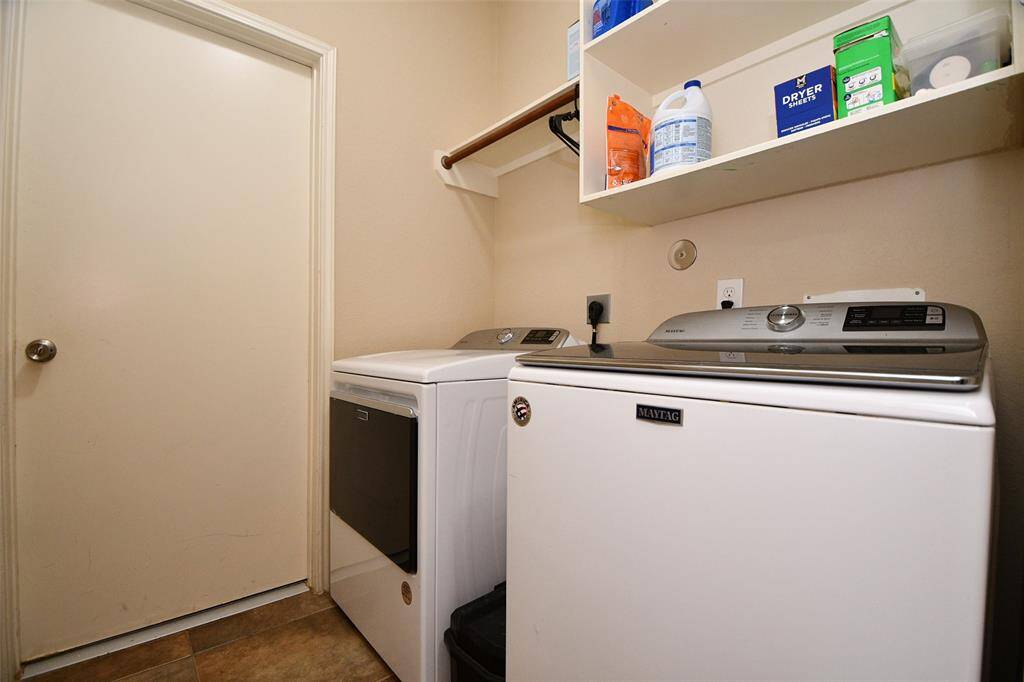 Laundry room off to the left before walking into the living area