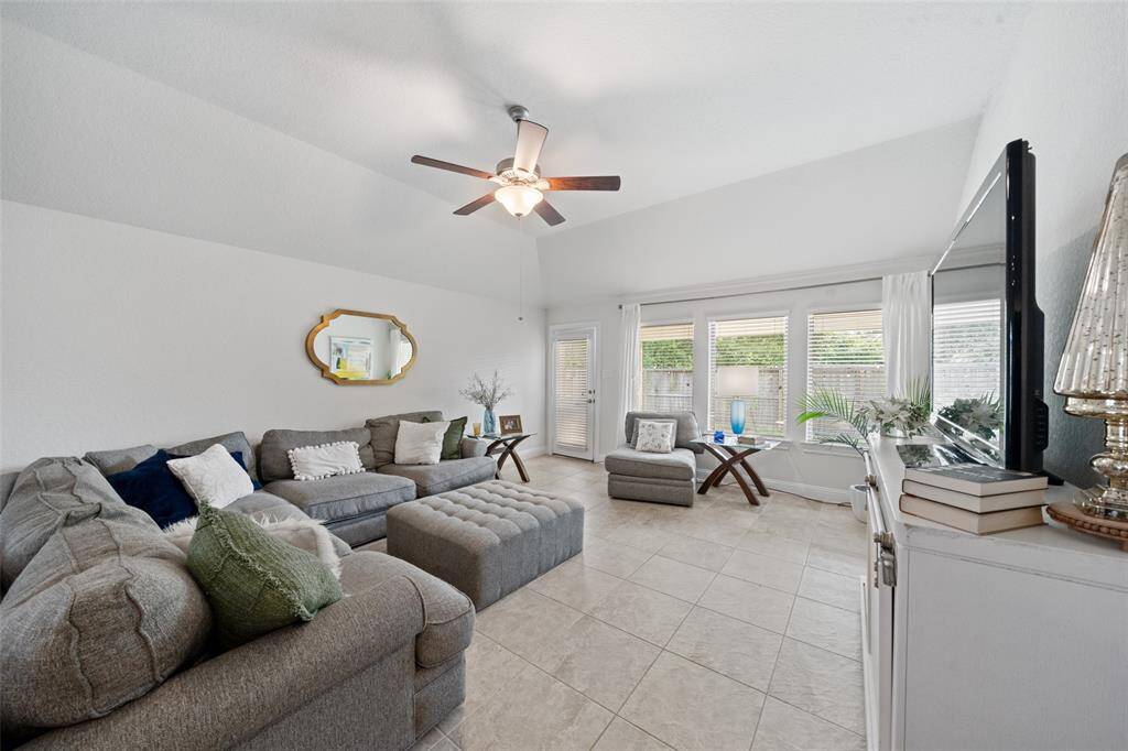 Living area with large windows.