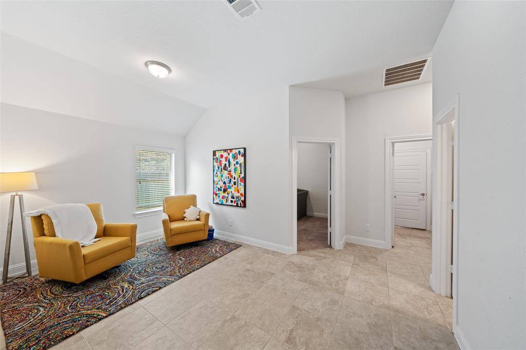 Flex space between secondary bedrooms currently set up as a sitting area.