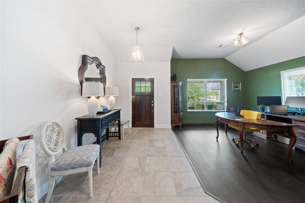 Entryway of home with formal dining area.