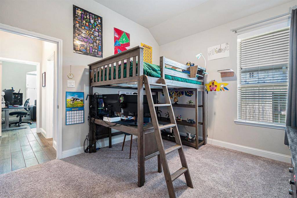 Another secondary bedroom with high ceilings.