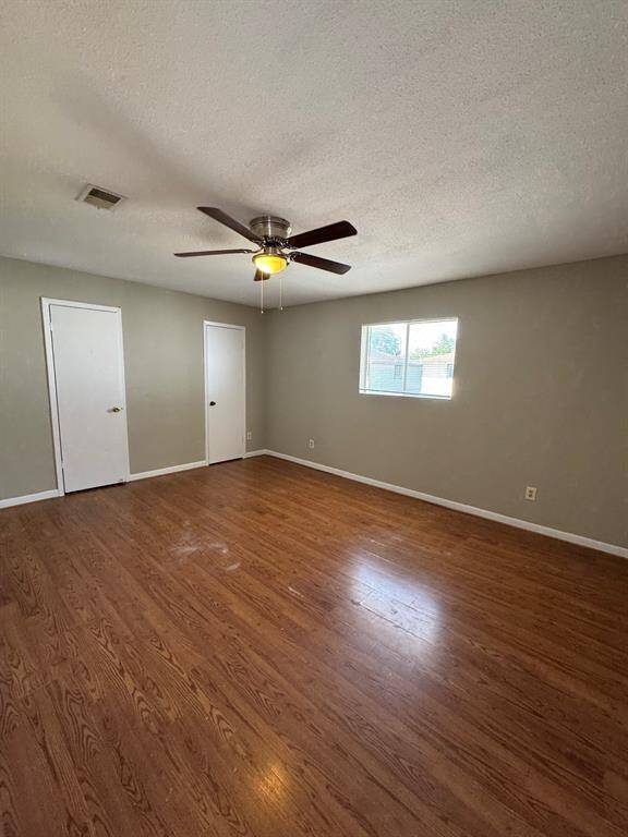 Welcome to another bedroom upstairs with wood floor throughout