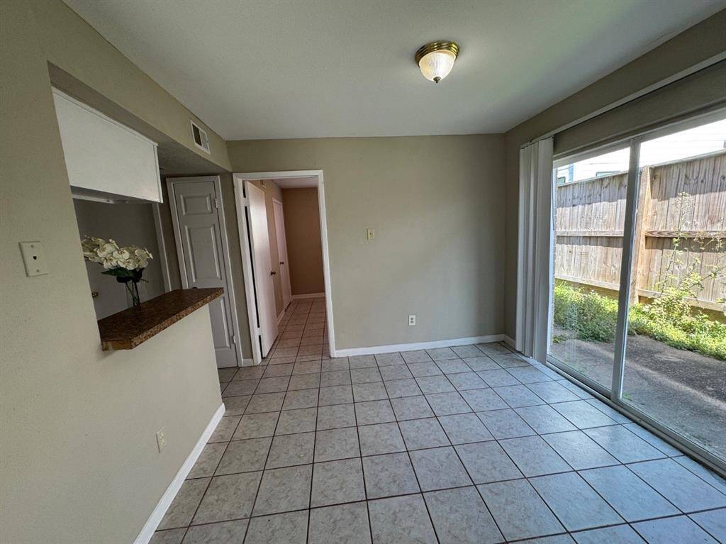 Another view to showcase the open concept design where spacious dining room effortlessly connects to the gourmet kitchen bathed in natural light!