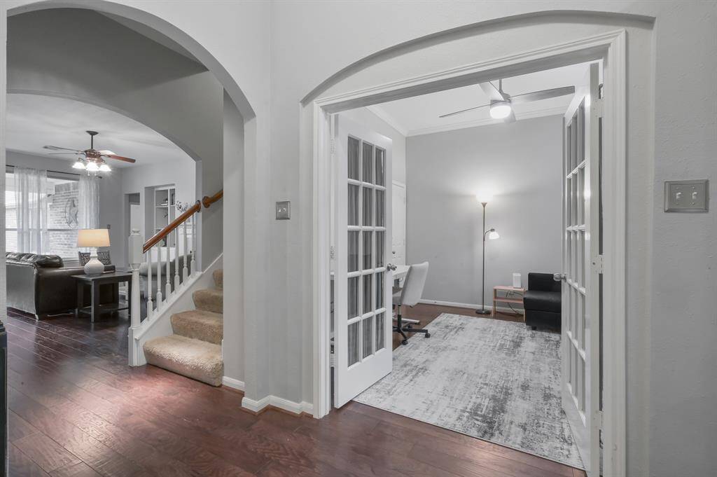 View from dining area and office/flex space into living room.