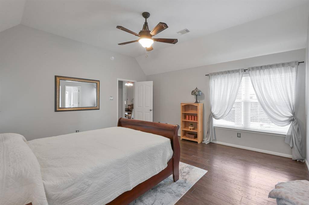 Another view of the primary bedroom.