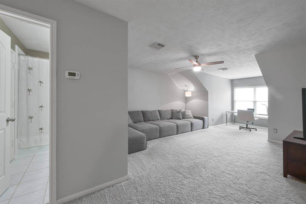 Upstairs: Use as a game room, TV room or additional bedroom with more than 400 sq. ft. of space! Dormer view of backyard and pre-wired and pre-mounted for large LCD TV — lots of possibilities!