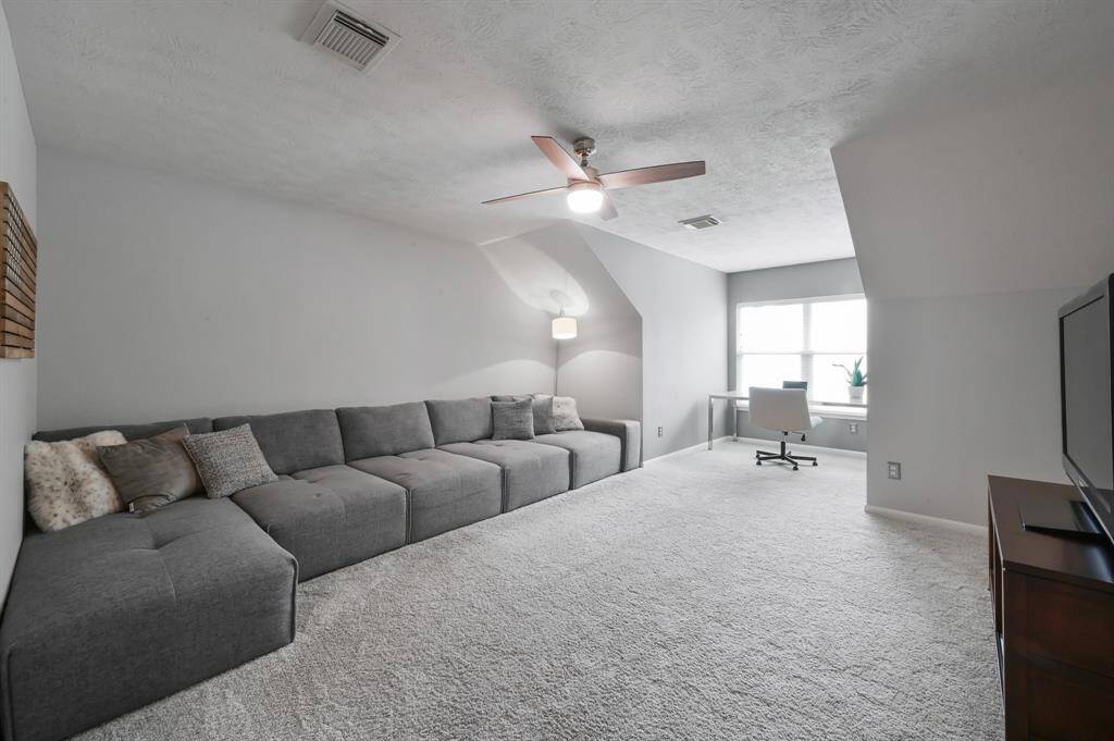 Another view of upstairs game room/flex room, with room for a large sectional and desk.