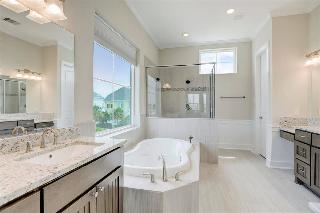 THE MASTER BATHROOM IS ALUXURIOUS RETREAT,FEATURING DOUBLE VANITIES, ALARGE SOAKING TUB ANDGLASS-ENCLOSED WALK-INSHOWER.