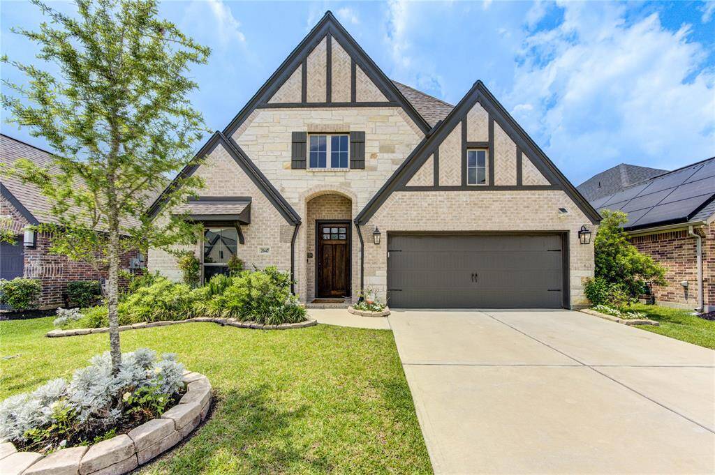 Tastefully upgraded one story PERRY home! Check out the elegant stone, brick and wood elevation!