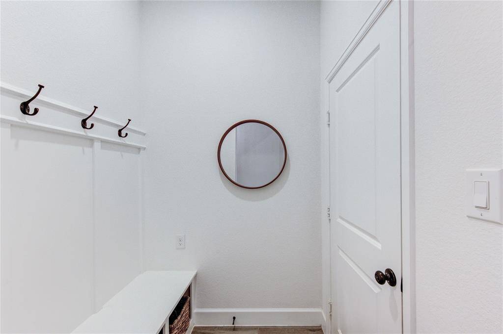 Mud room off the garage provide a warm welcome to your home.