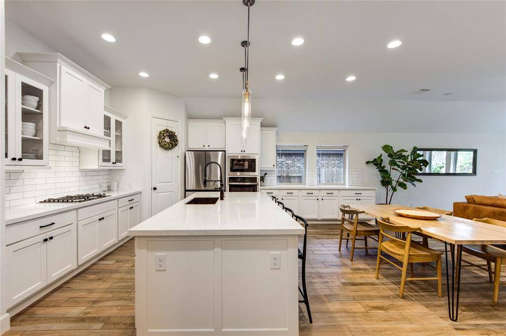 Plenty of cabinets with stunning quartz countertops .