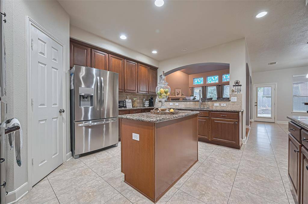 The kitchen is central and connects the family room, the breakfast area and formal dining room.