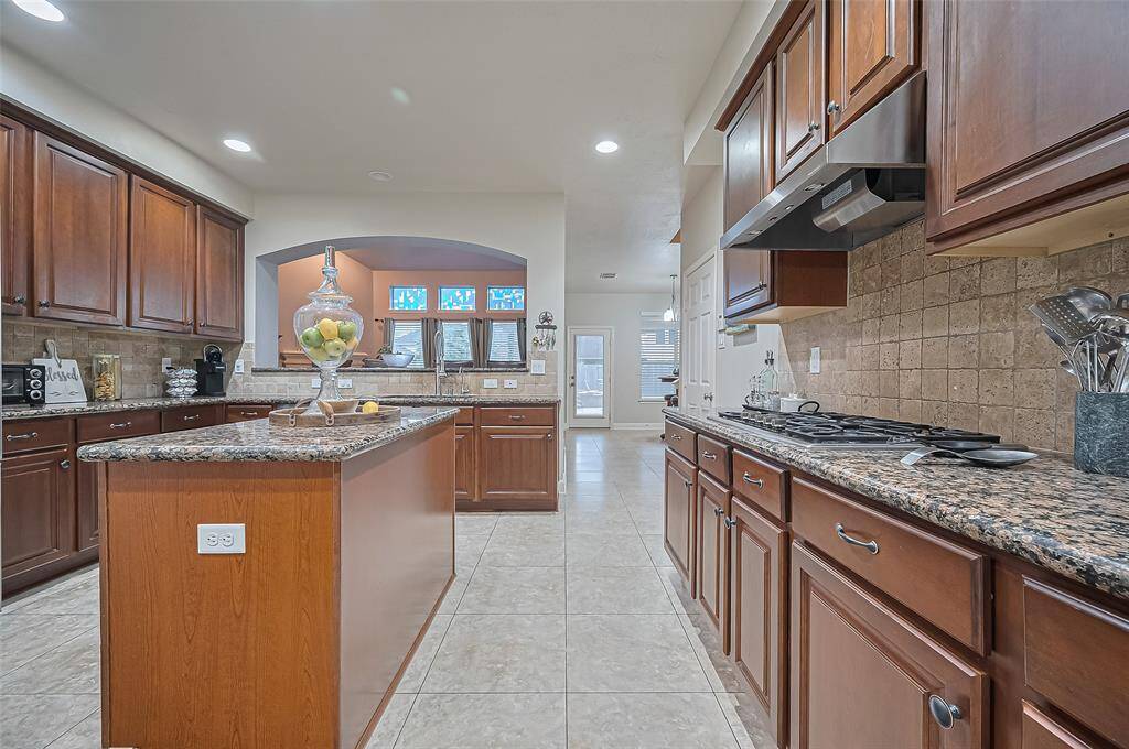 Another view of your gourmet kitchen showiing the granite countertops.