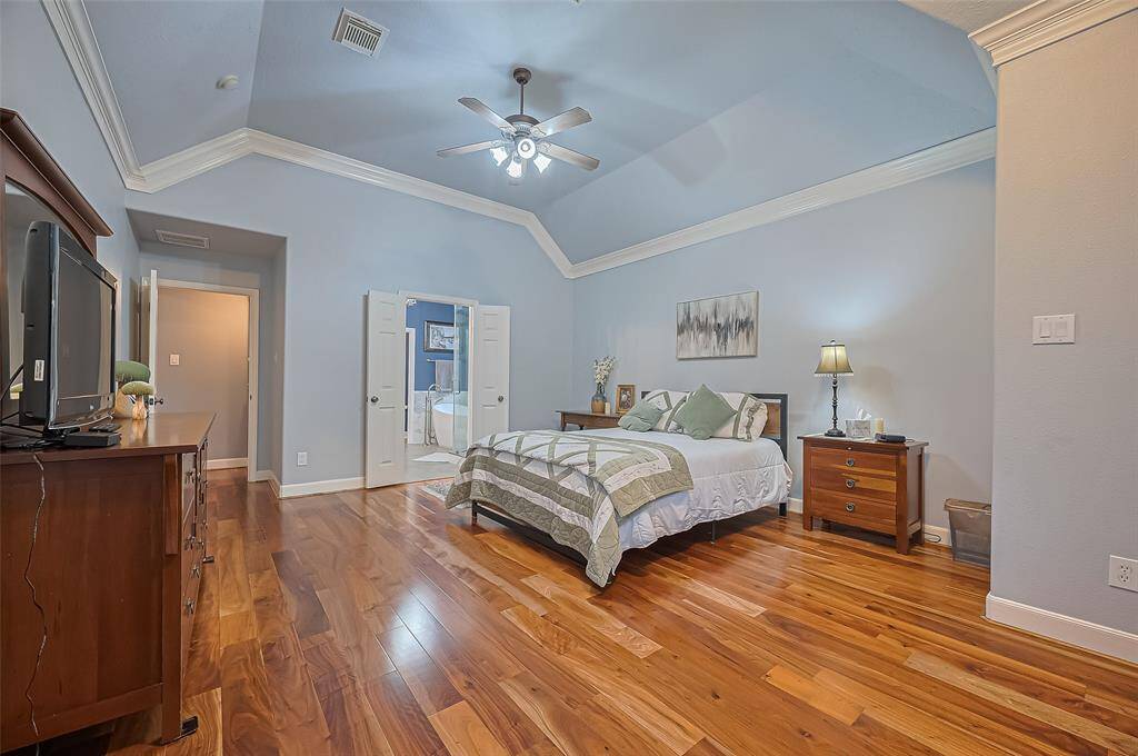 Another view of the primary bedroom. The french doors leads to the primary ensuite bathroom.