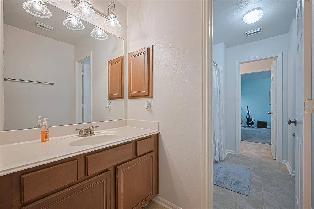 Each bedroom has its own sink and vanity.