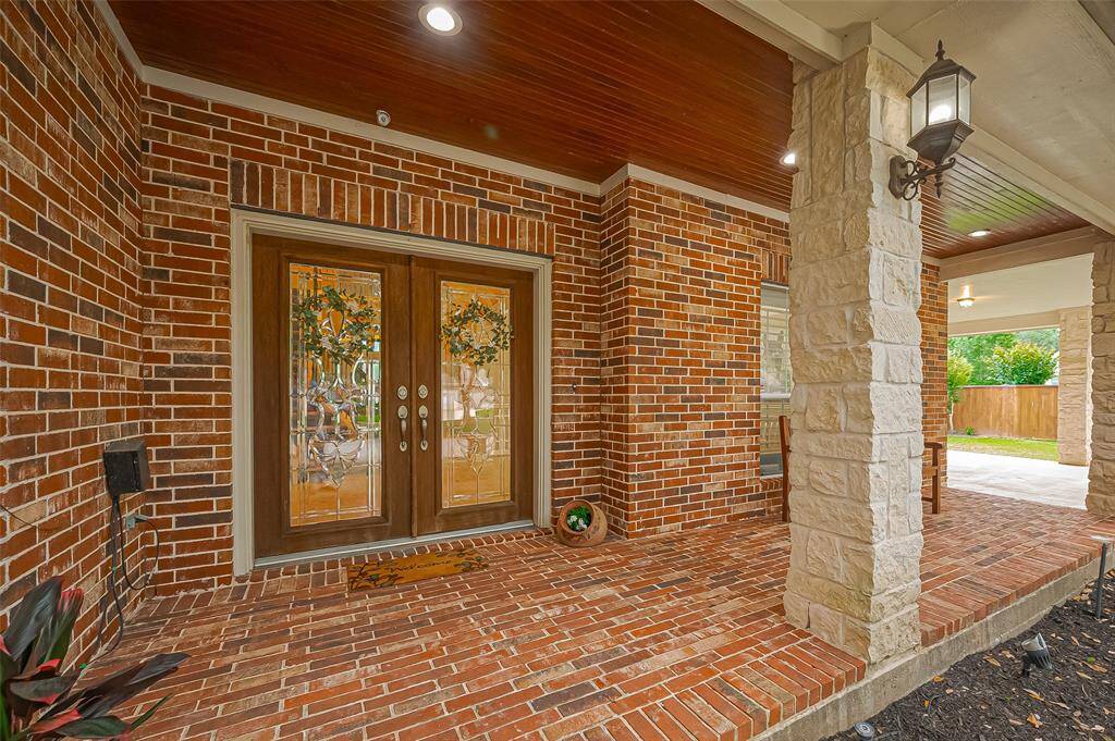 On the large front porch, you enter your home through the large Mahogany double doors.