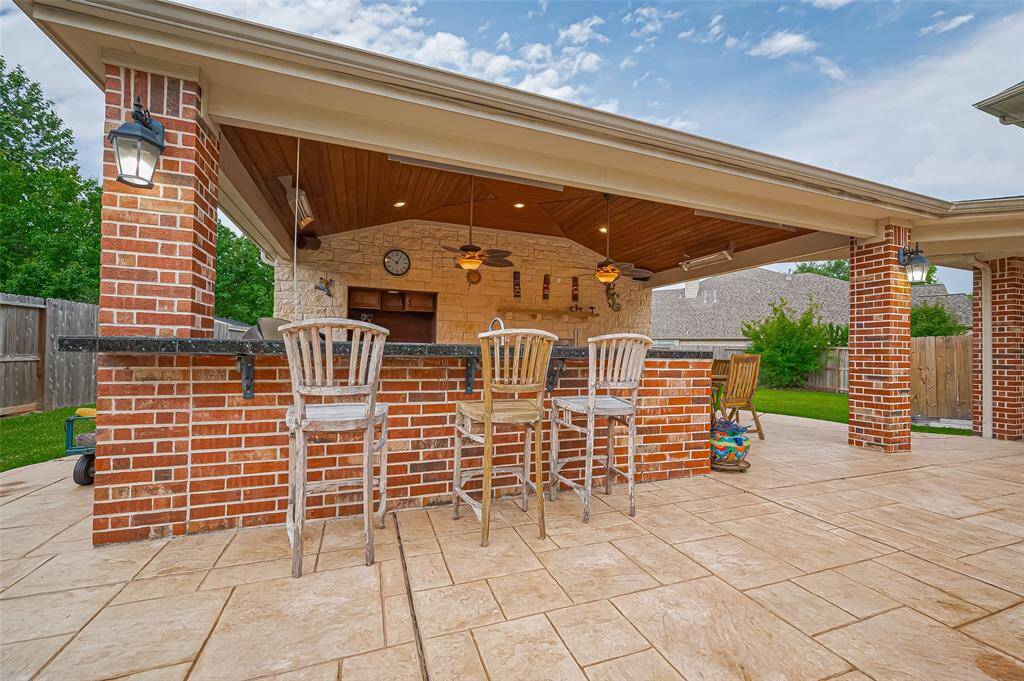 The outdoor kitchen is a beautiful addition to the home.