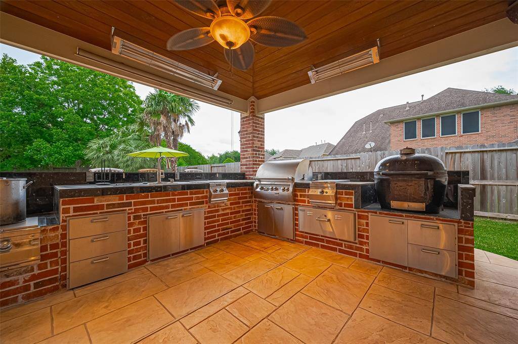 There is a crawfish cooktop, sink, smoker and grills.